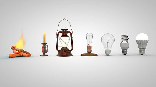 A evolução das lâmpadas. Começando por uma fogueira, vela, lampião, lâmpada incandescente com filamento de carbono, lâmpada incandescente com filamento de tungstênio, lâmpada  fluorescente e finalmente a lâmpada de LED.